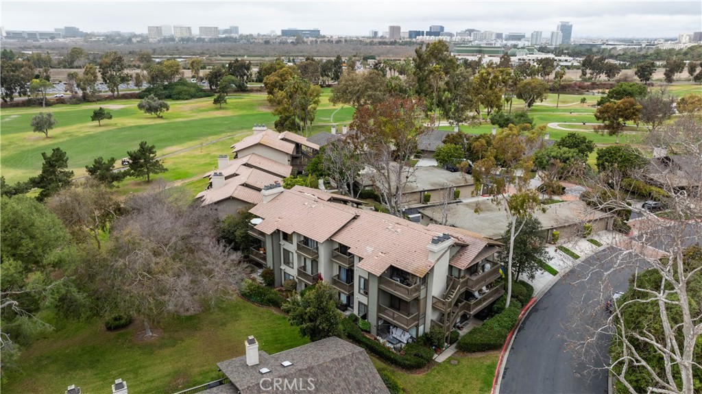 9 Flores Irvine, CA 92612 - Photo 34 of 38 an aerial view of a house with a garden and lake view