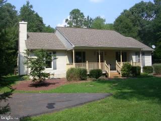 25022 Collins Wharf Road Eden, MD 21822 - Photo 1 of 10 a view of a house with a yard