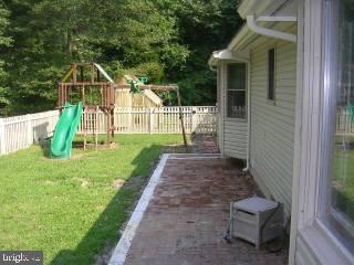 25022 Collins Wharf Road Eden, MD 21822 - Photo 8 of 10 a view of a house with a yard