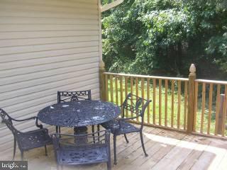 25022 Collins Wharf Road Eden, MD 21822 - Photo 9 of 10 a view of balcony with table and chairs
