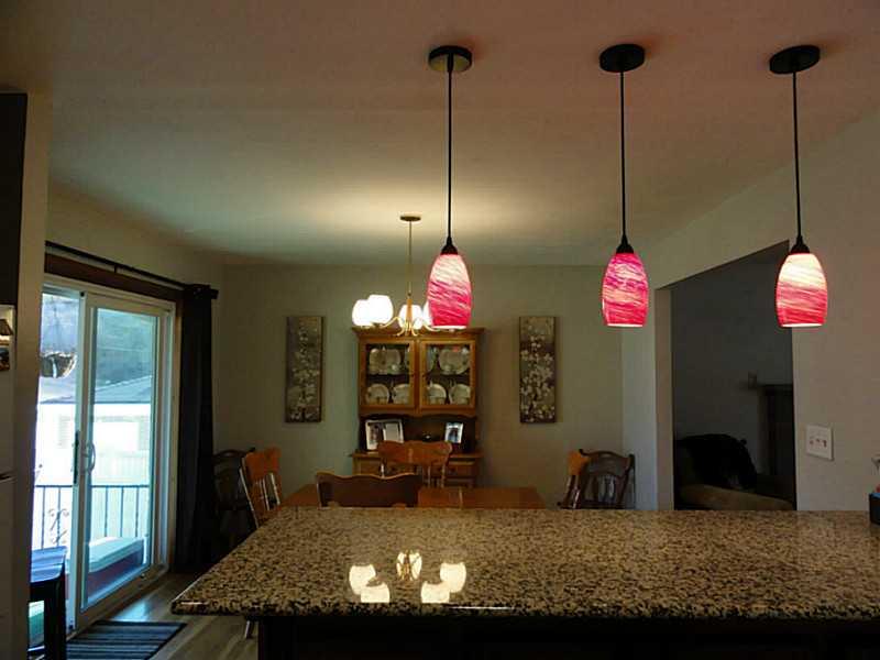 104 Kingsdale Road Churchill, PA 15221 - Photo 7 of 24 Kitchen. Colorful pendant lights over the peninsula in the kitchen looking into the dining room.