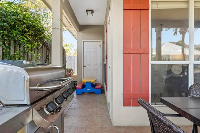 a backyard of a house with outdoor seating