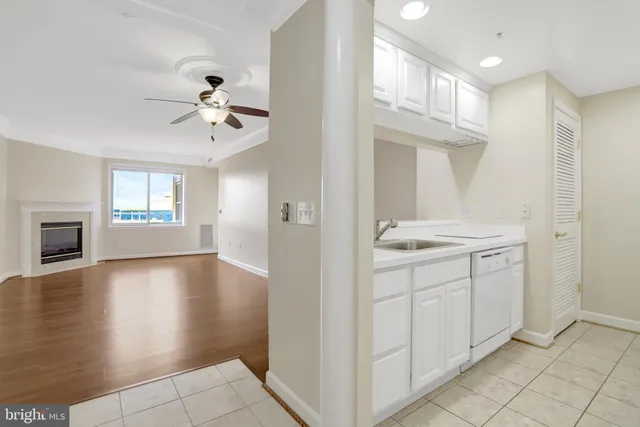 a bathroom with a granite countertop sink a mirror and a shower