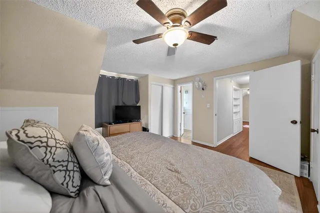 a living room with furniture and a ceiling fan
