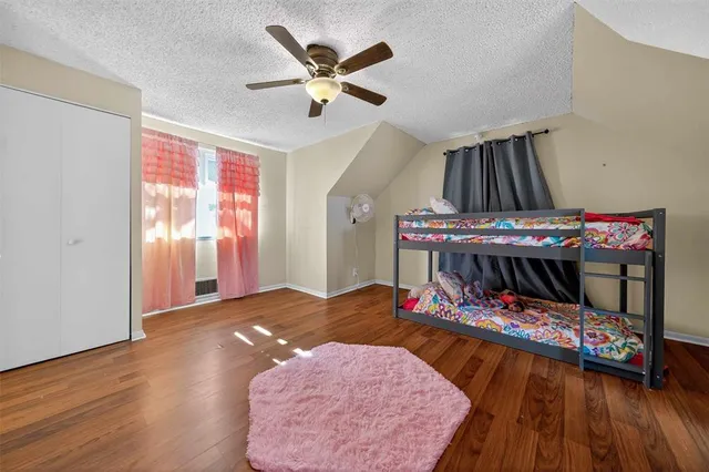 a bed room with a bed and a chandelier