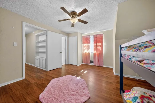 a very nice looking room with a ceiling fan