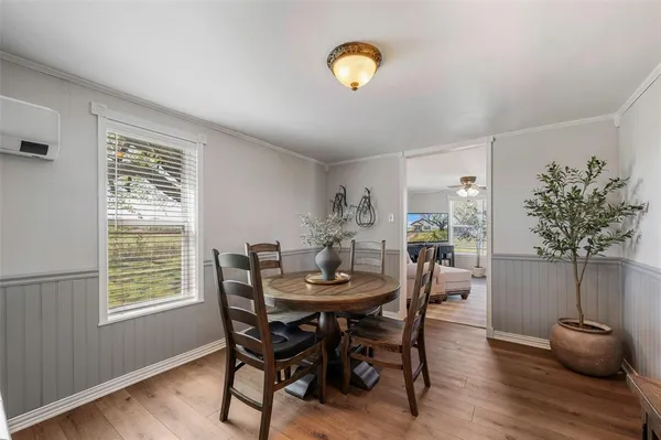 a dining room with furniture and window