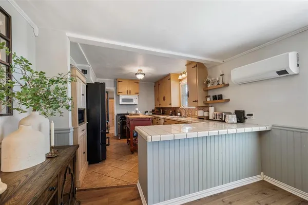 a kitchen with a sink stove and refrigerator