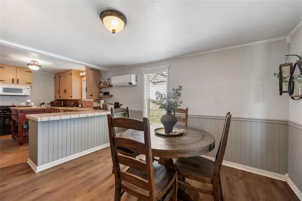 a kitchen with a table and chairs in it