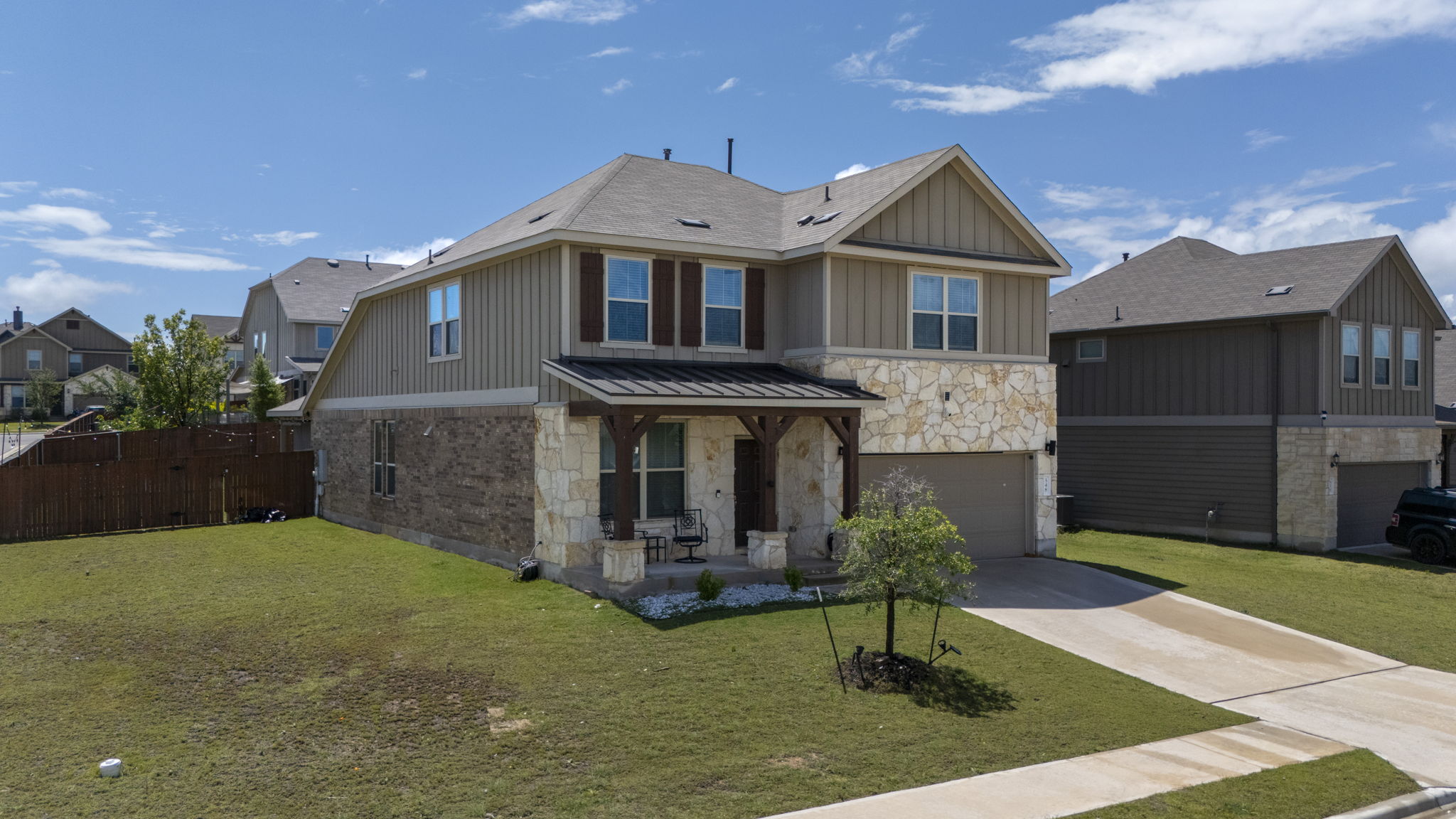 548 Purple Heart Drive Buda, TX 78610 - Photo 33 of 35 A welcoming stone and siding facade offers excellent curb appeal and a covered front porch.