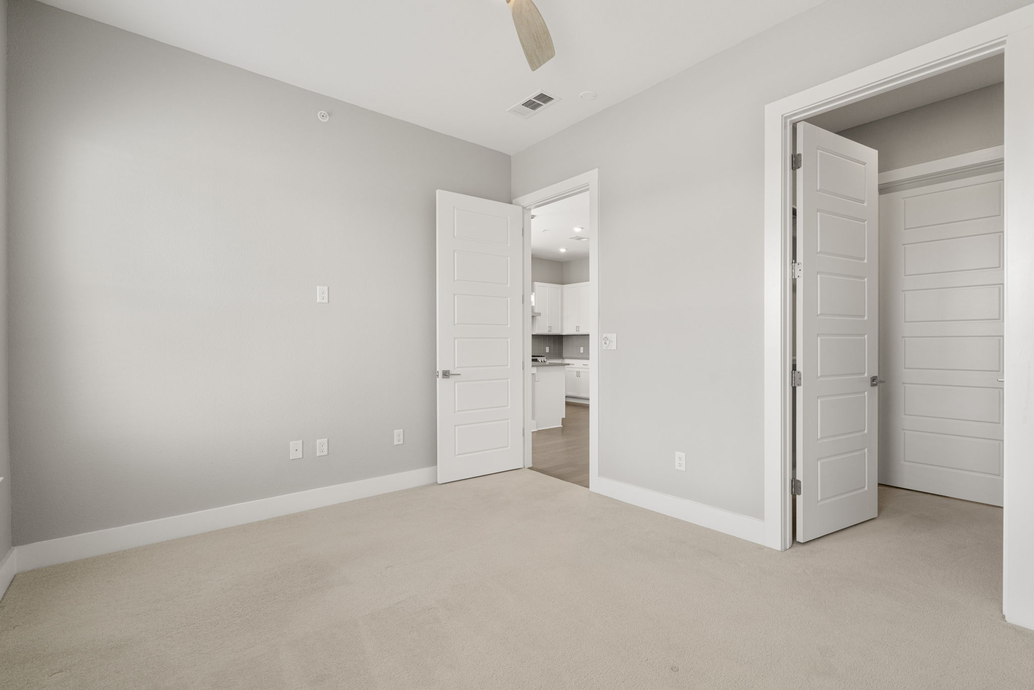 4501 Jackson Avenue, Unit 5205 Austin, TX 78731 - Photo 13 of 40 Unfurnished bedroom with light colored carpet and ceiling fan