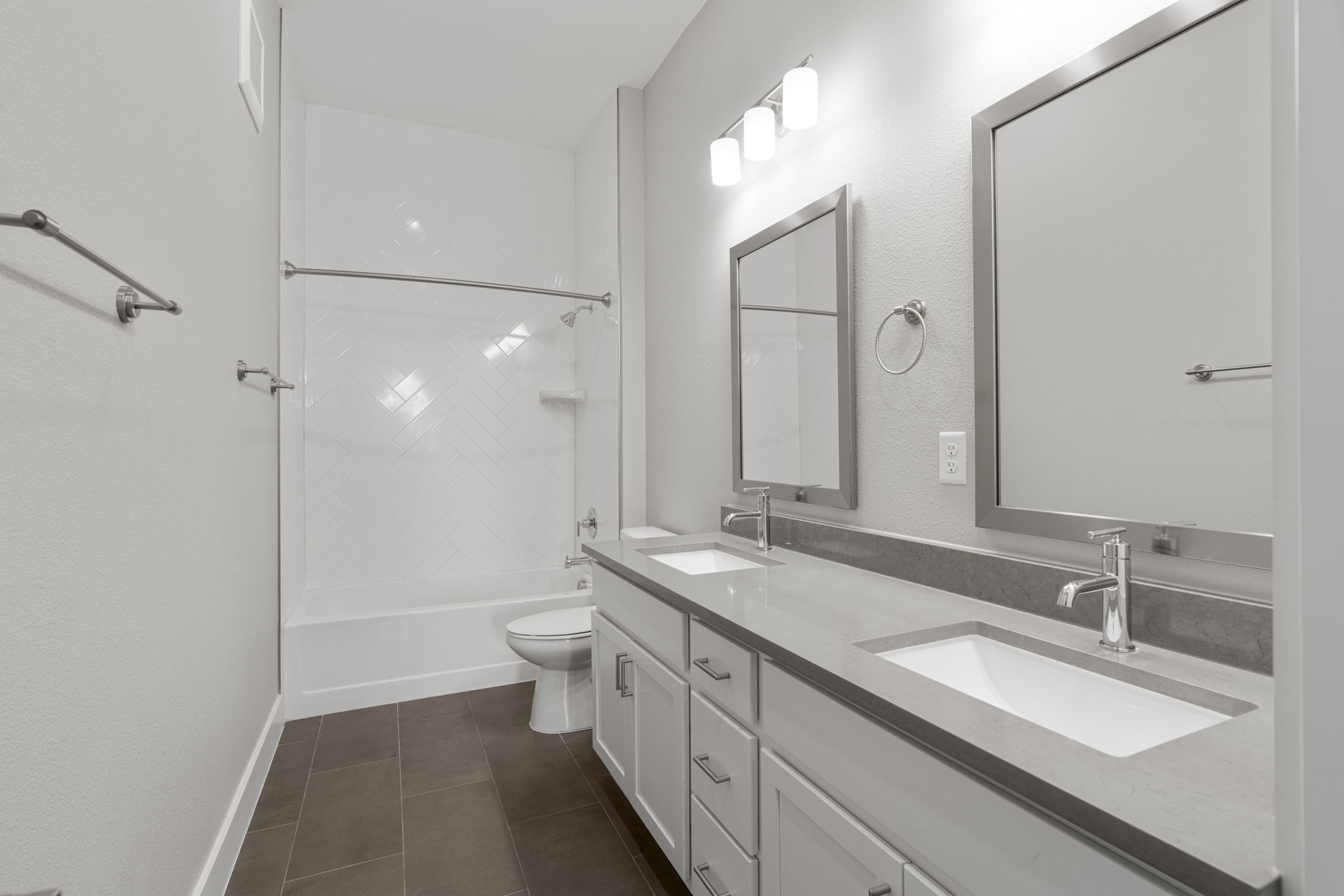 4501 Jackson Avenue, Unit 5205 Austin, TX 78731 - Photo 17 of 40 Bathroom with double vanity, shower / bath combination, and dark tile patterned flooring