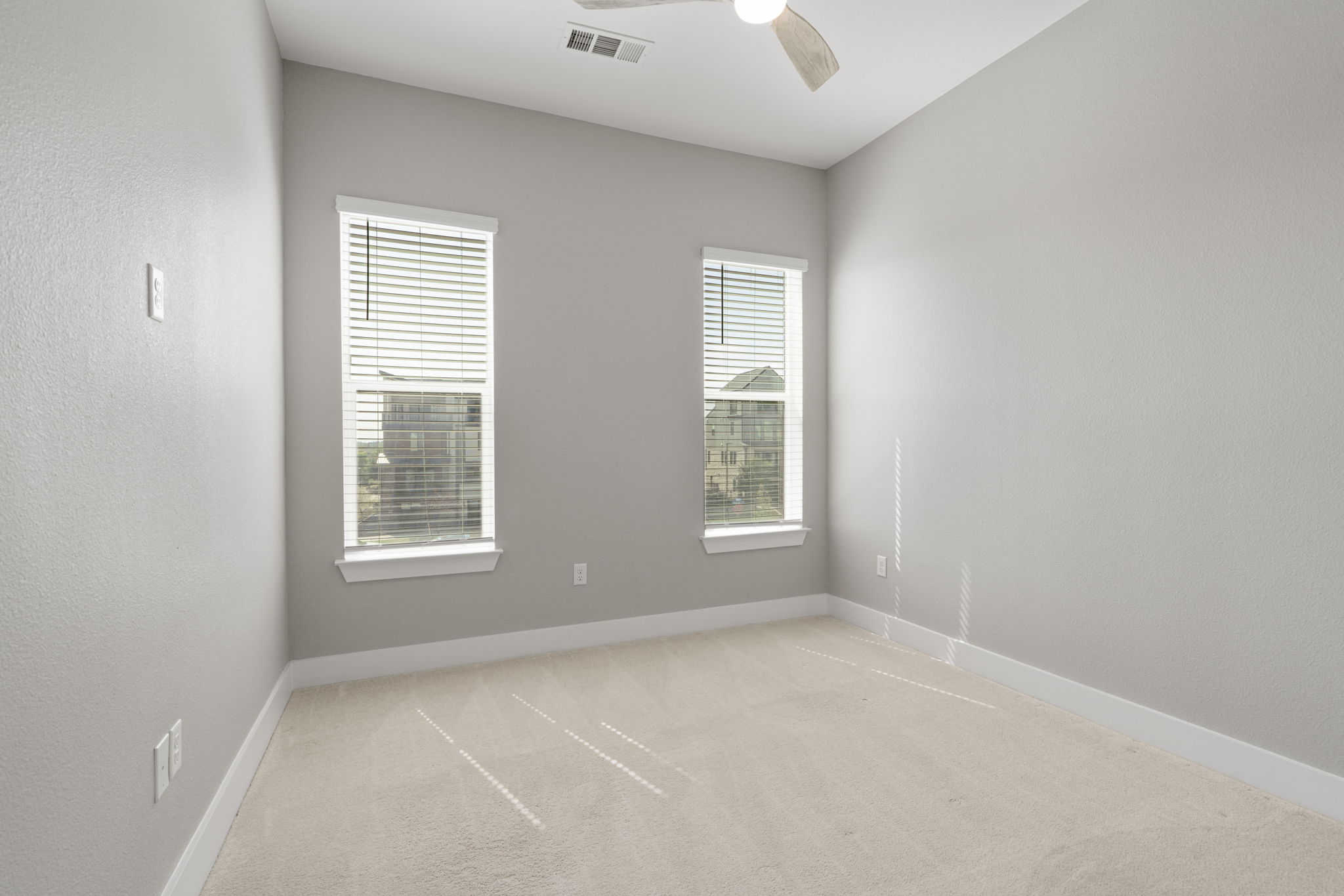 4501 Jackson Avenue, Unit 5205 Austin, TX 78731 - Photo 19 of 40 Spare room with light colored carpet and ceiling fan