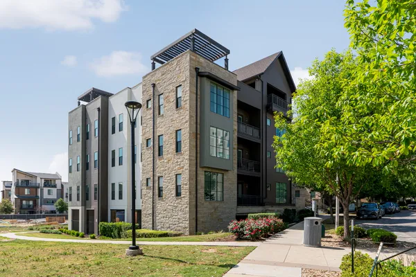 a view of a building with a yard