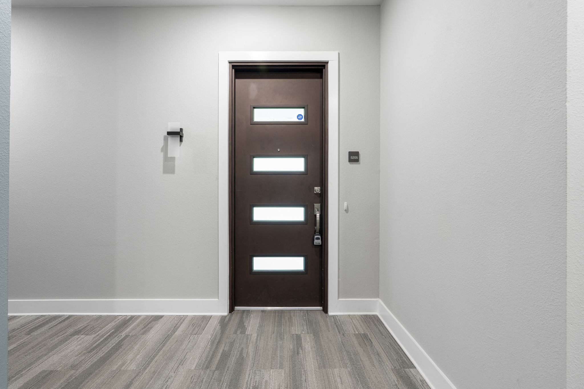 4501 Jackson Avenue, Unit 5205 Austin, TX 78731 - Photo 21 of 40 Foyer entrance with wood finished floors and baseboards