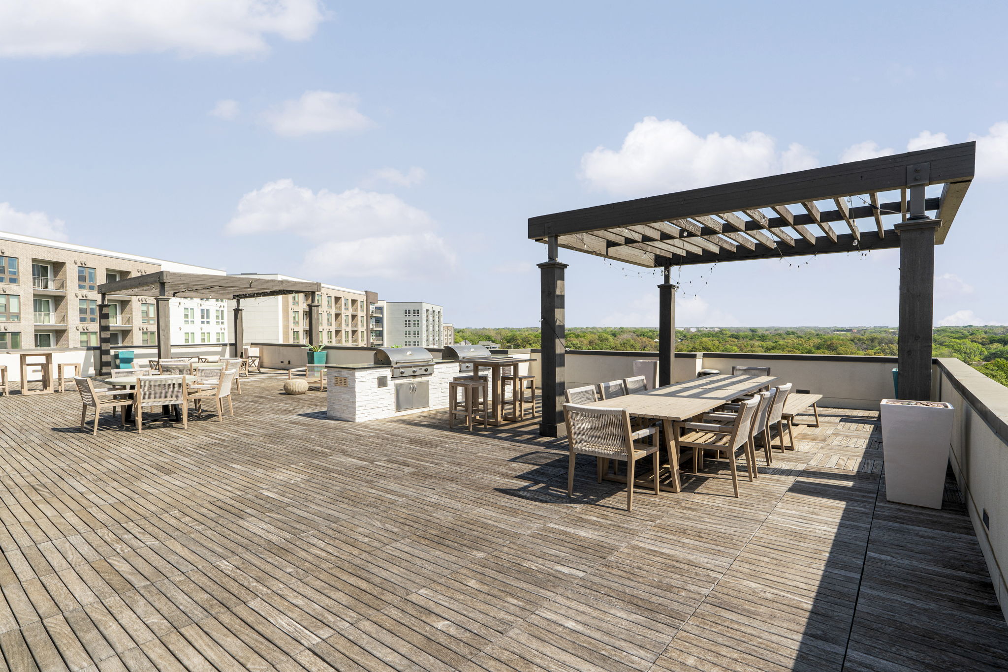 4501 Jackson Avenue, Unit 5205 Austin, TX 78731 - Photo 25 of 40 Wooden terrace with a pergola and an outdoor kitchen / dining area