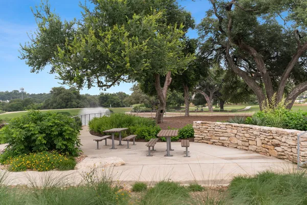 a view of a lake with a table and a chair
