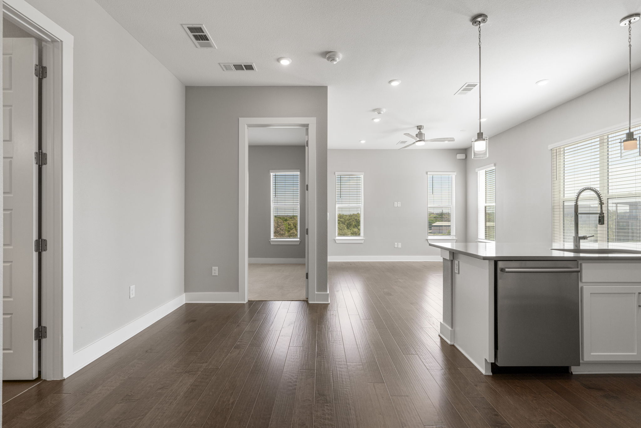 4501 Jackson Avenue, Unit 5205 Austin, TX 78731 - Photo 40 of 40 Kitchen featuring dishwasher, dark wood-style flooring, decorative light fixtures, open floor plan, and ceiling fan