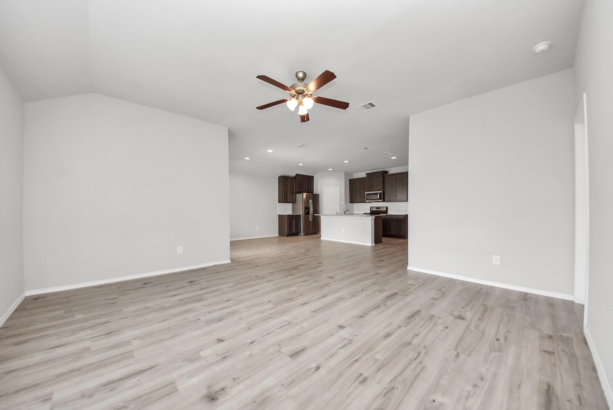 3305 Jagged Crow Lane Conroe, TX 77301 - Photo 11 of 30 wooden floor in an empty room with a window