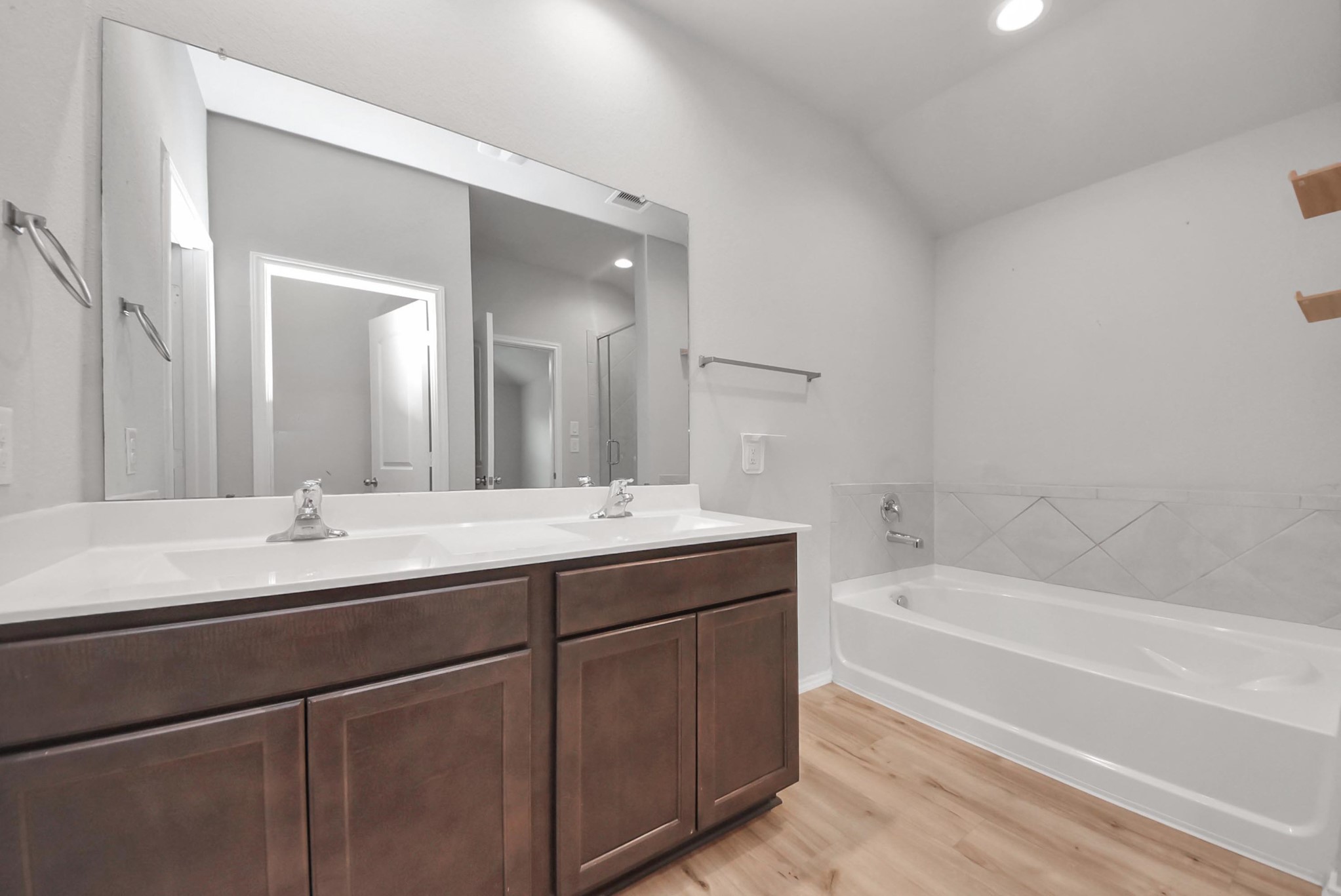 3305 Jagged Crow Lane Conroe, TX 77301 - Photo 16 of 30 a bathroom with a tub a sink and mirror