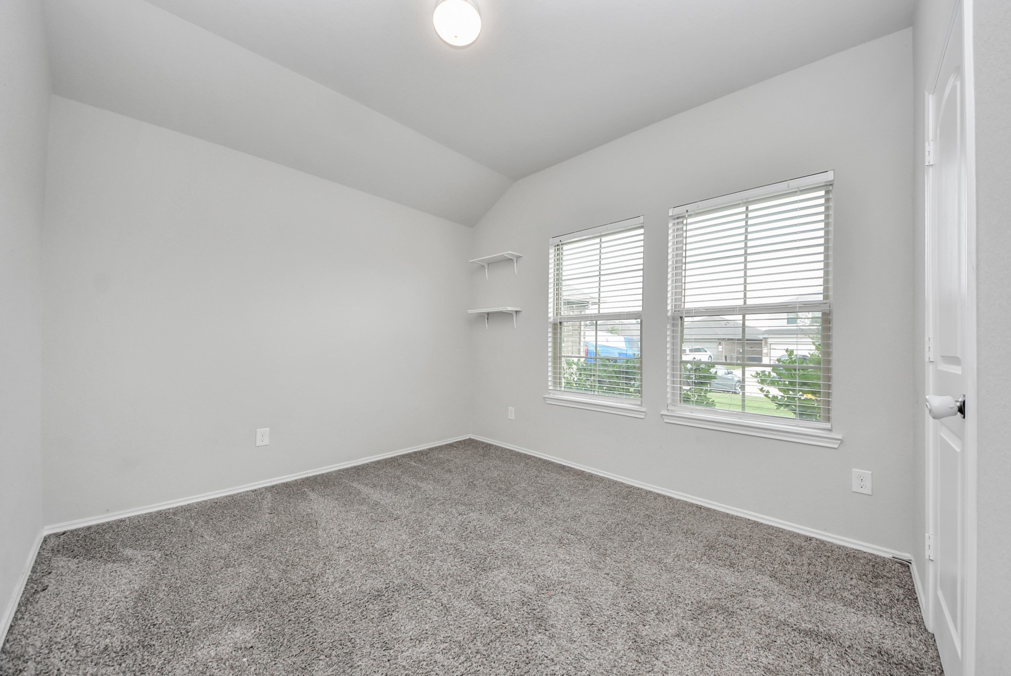 3305 Jagged Crow Lane Conroe, TX 77301 - Photo 18 of 30 an empty room with windows
