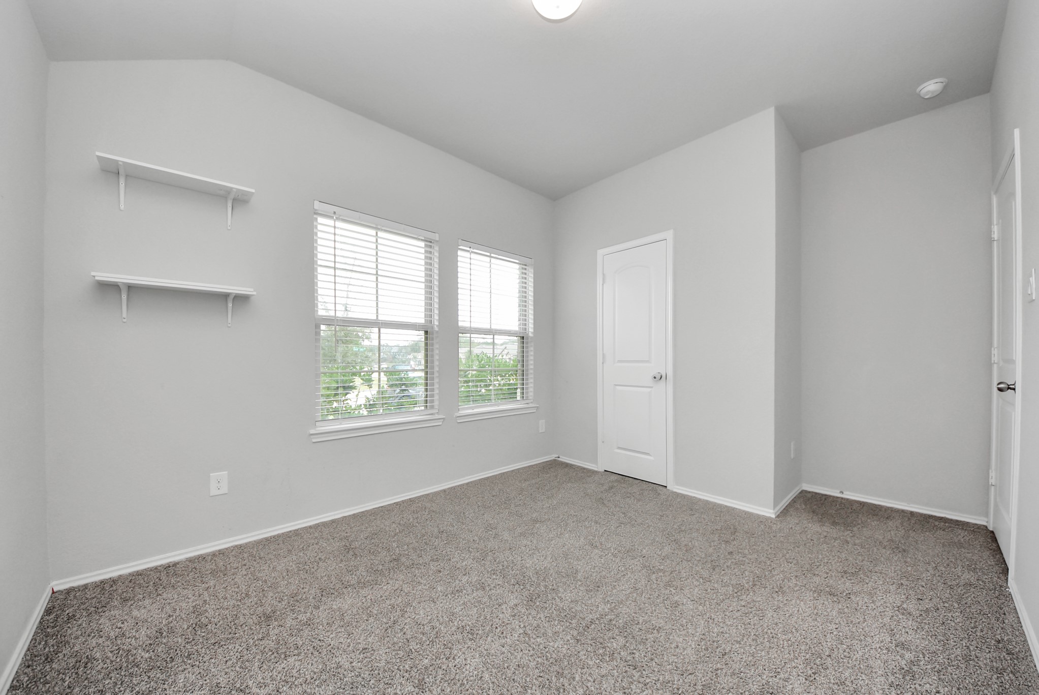 3305 Jagged Crow Lane Conroe, TX 77301 - Photo 19 of 30 a view of an empty room with a window