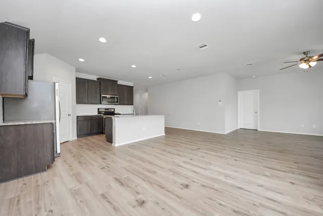 a view of kitchen with wooden floor