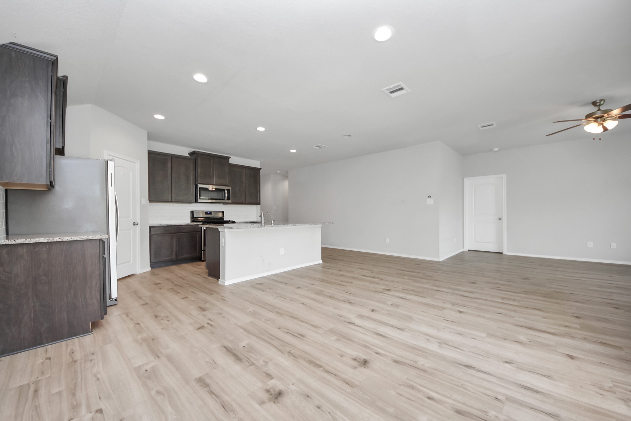 3305 Jagged Crow Lane Conroe, TX 77301 - Photo 4 of 30 a view of kitchen with wooden floor
