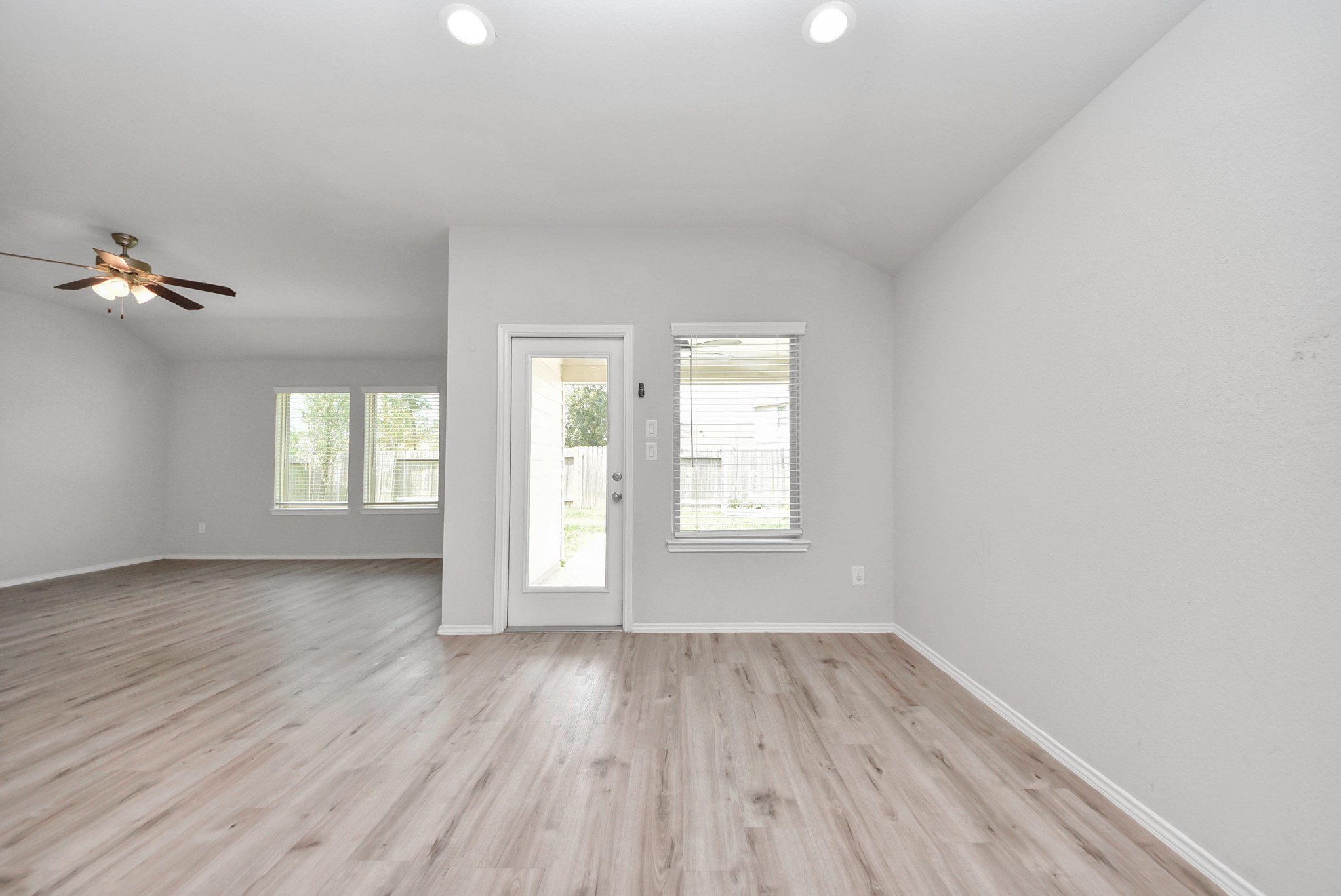 3305 Jagged Crow Lane Conroe, TX 77301 - Photo 6 of 30 wooden floor in an empty room with a window