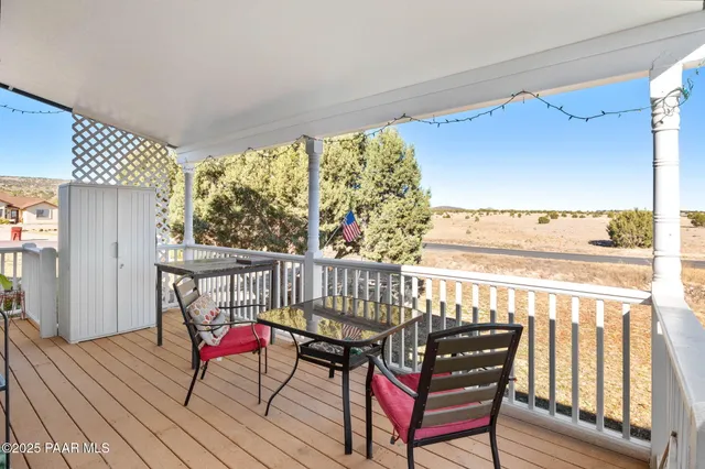 a view of a balcony with chairs