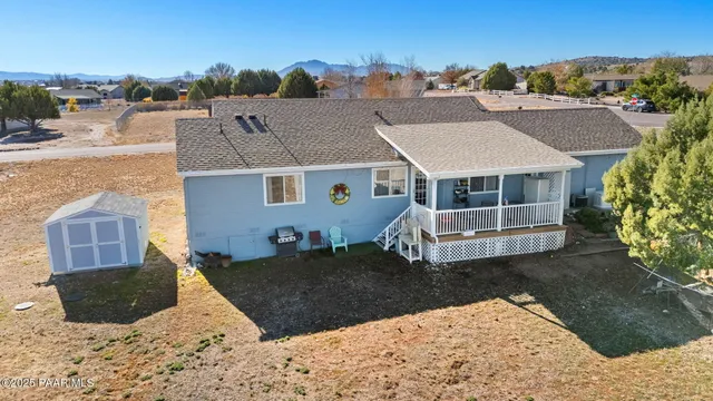 a aerial view of a house with a yard