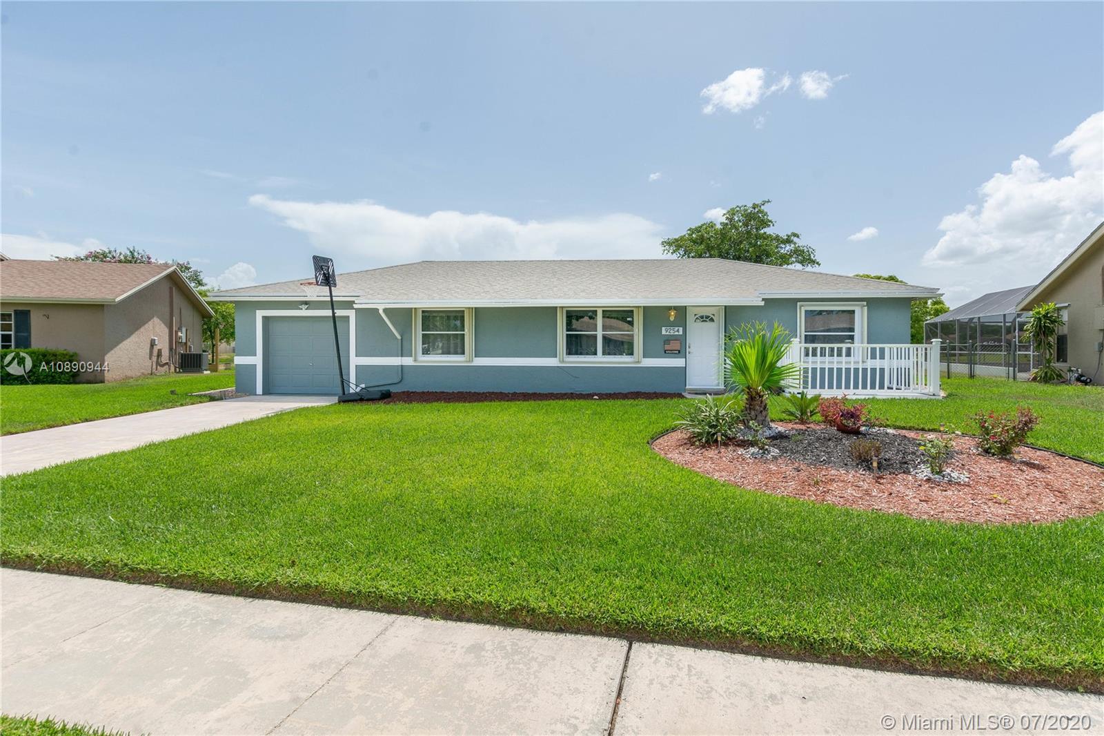 9254 Gettysburg Road Boca Raton, FL 33434 - Photo 1 of 49 a view of house with a garden