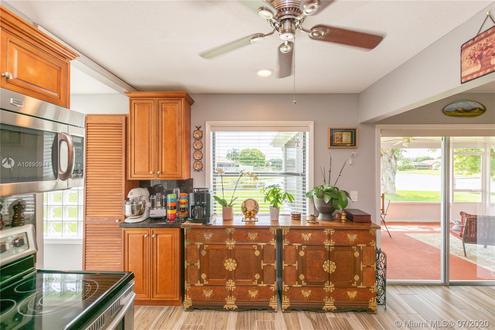 9254 Gettysburg Road Boca Raton, FL 33434 - Photo 20 of 49 a view of living room with furniture and large windows