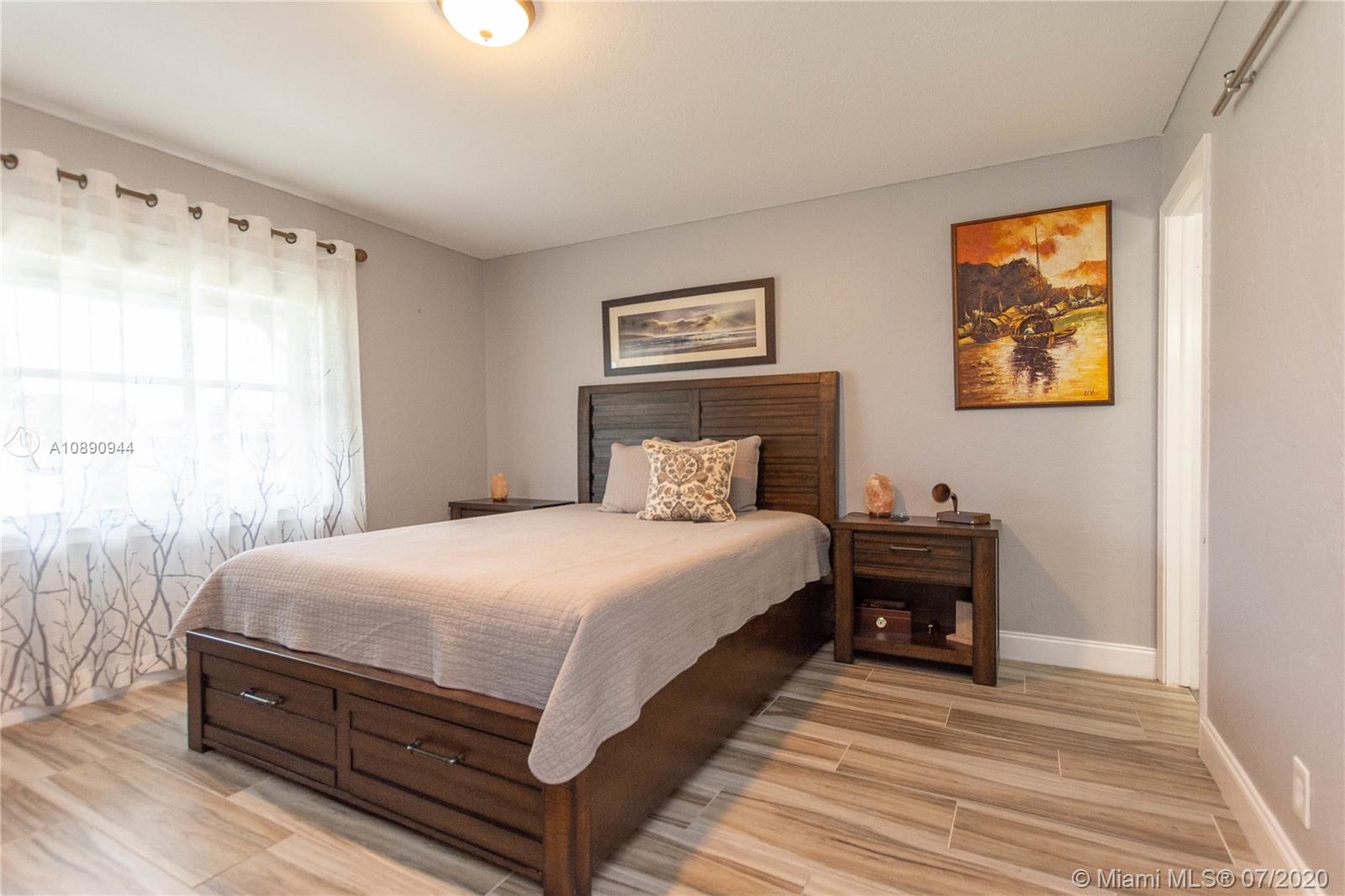 9254 Gettysburg Road Boca Raton, FL 33434 - Photo 23 of 49 a bedroom with a bed and window
