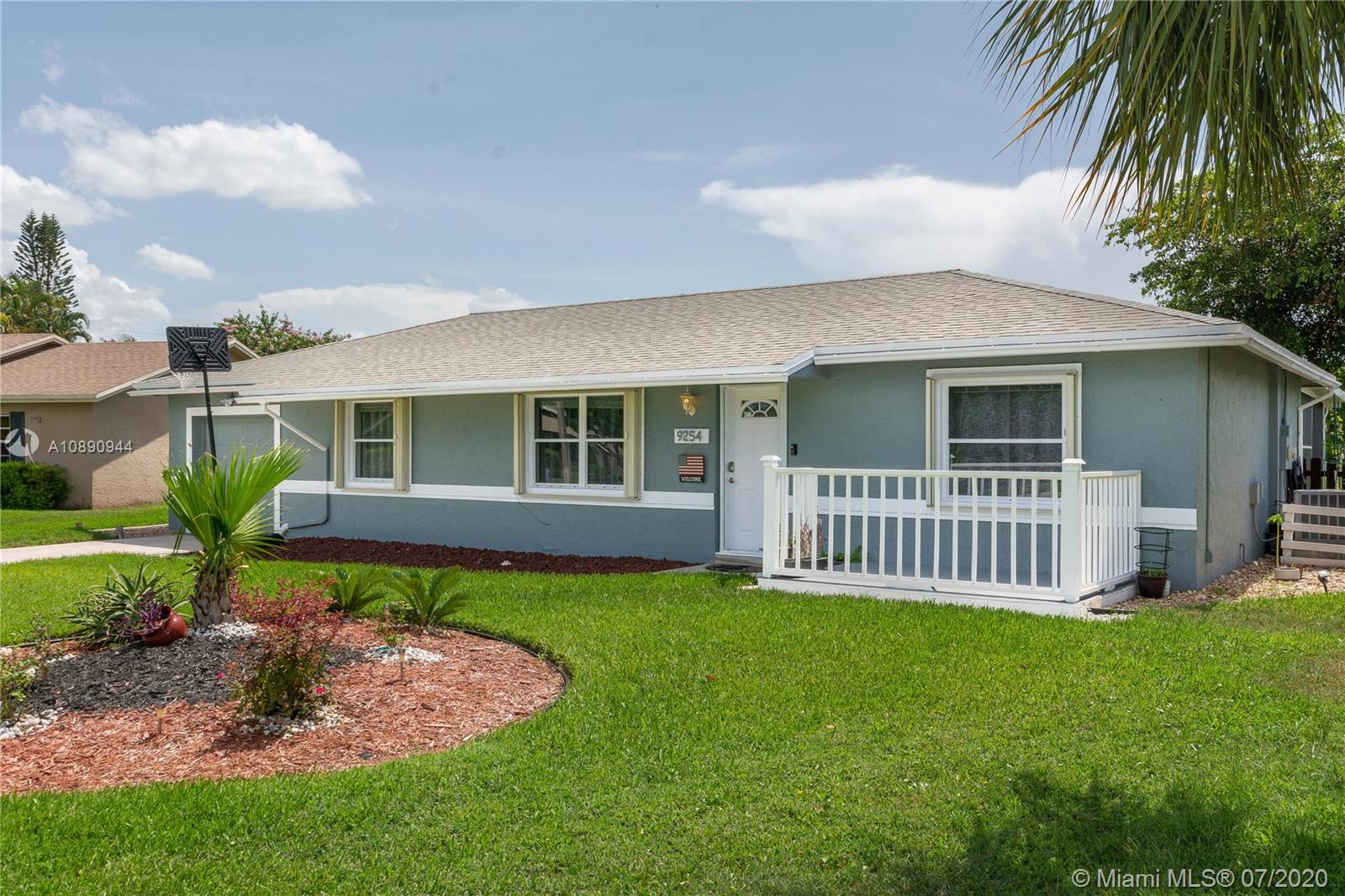 9254 Gettysburg Road Boca Raton, FL 33434 - Photo 3 of 49 a view of a house with a yard and porch