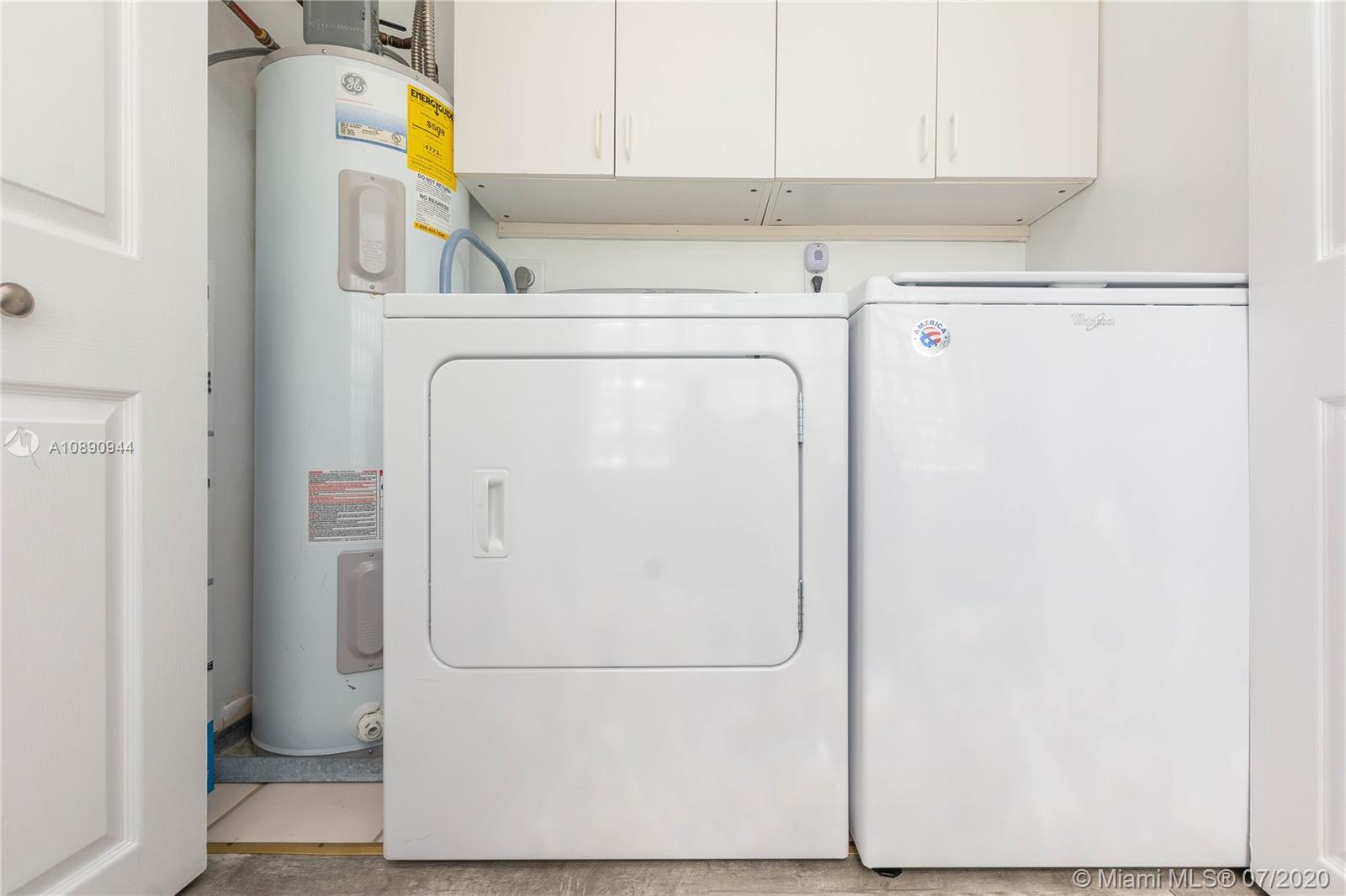 9254 Gettysburg Road Boca Raton, FL 33434 - Photo 38 of 49 a utility room with dryer and washer