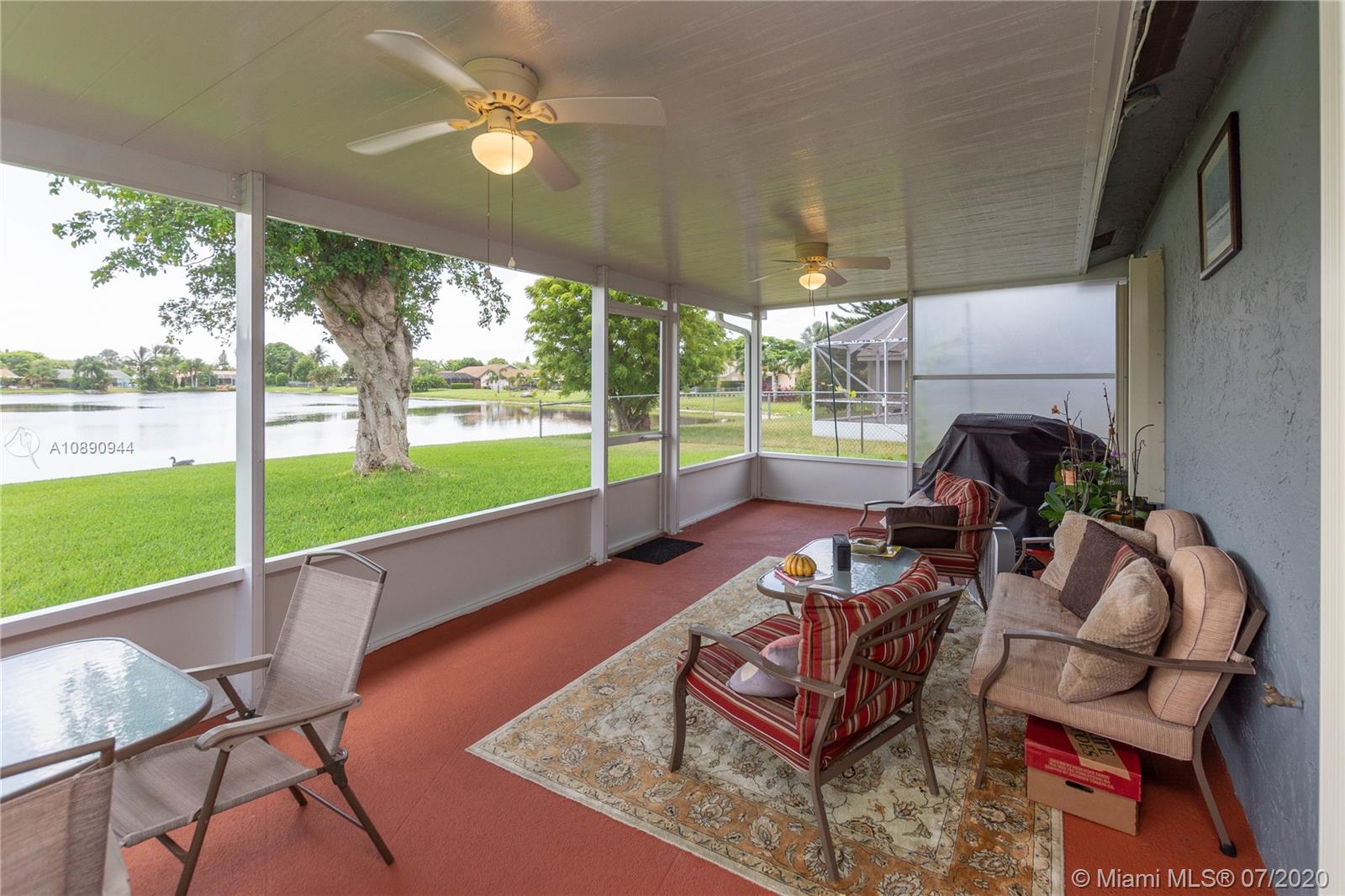 9254 Gettysburg Road Boca Raton, FL 33434 - Photo 39 of 49 a view of a patio with a yard