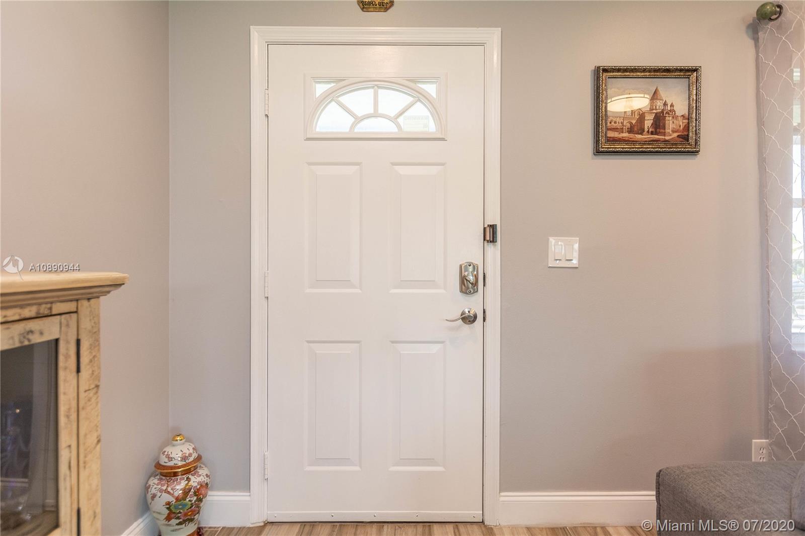 9254 Gettysburg Road Boca Raton, FL 33434 - Photo 5 of 49 a view of front door with a door