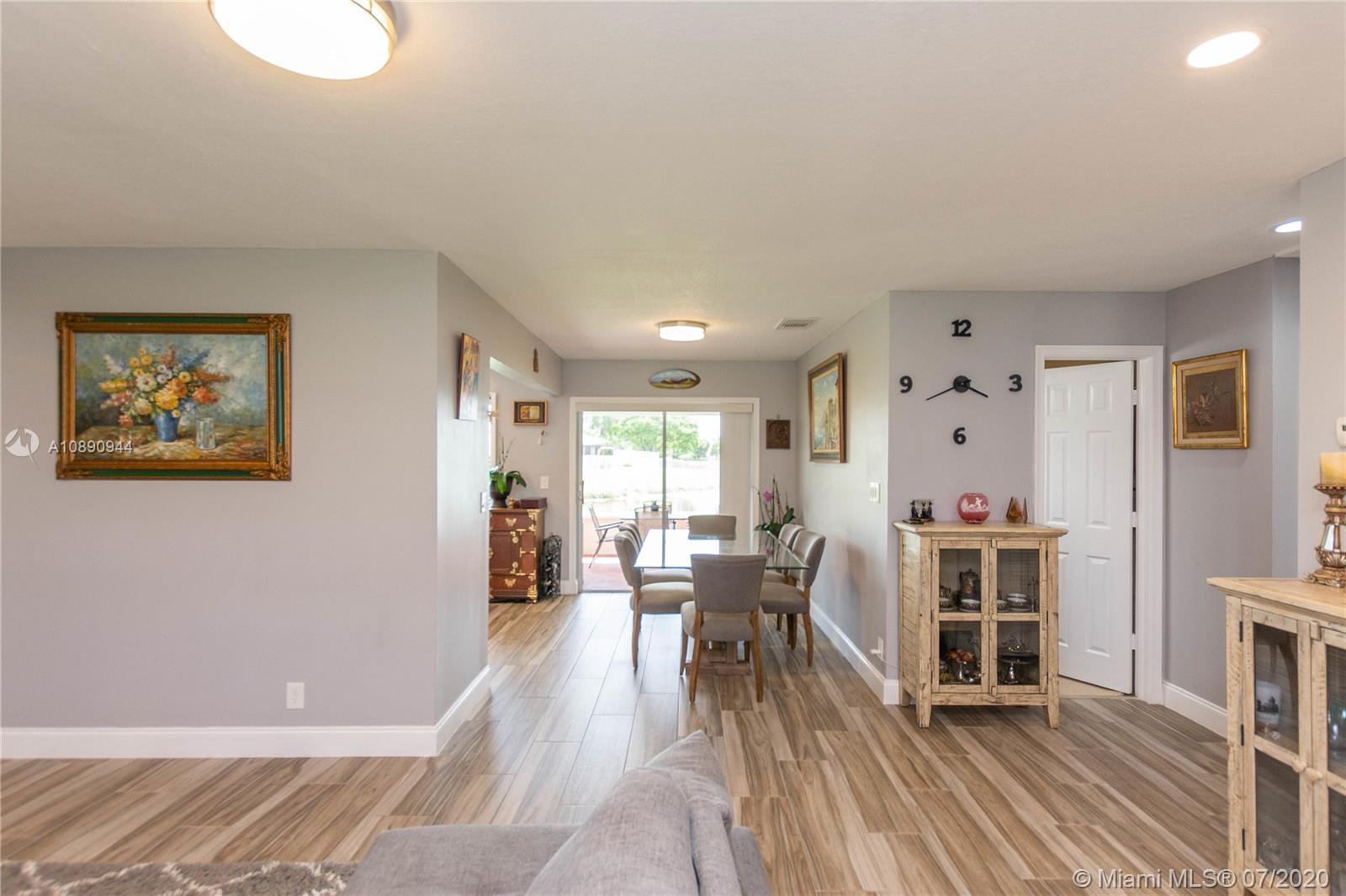 9254 Gettysburg Road Boca Raton, FL 33434 - Photo 10 of 49 a dining room with furniture and wooden floor