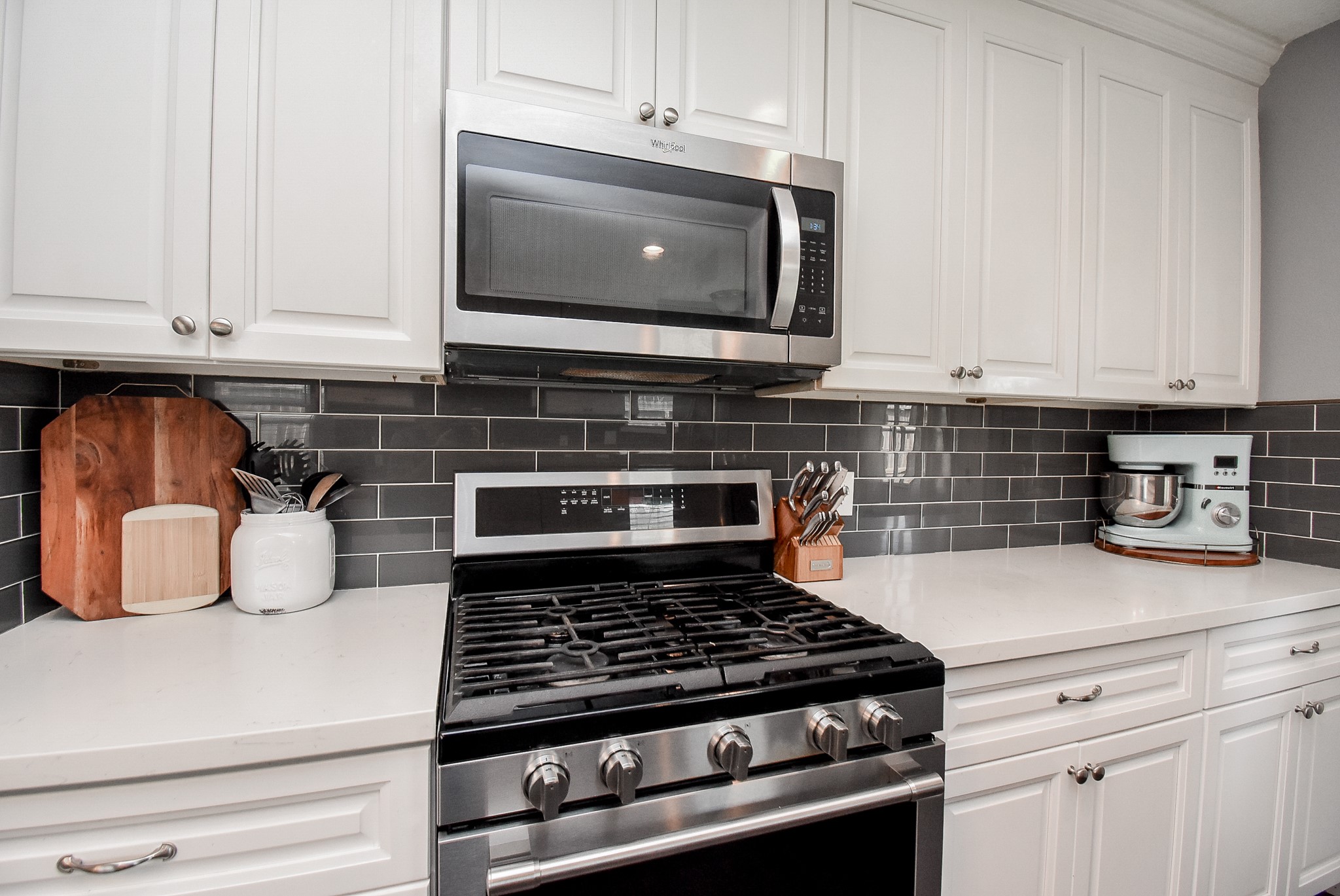 5911 Butterfly Circle Pasadena, TX 77505 - Photo 15 of 45 a kitchen with stainless steel appliances granite countertop a stove and a microwave