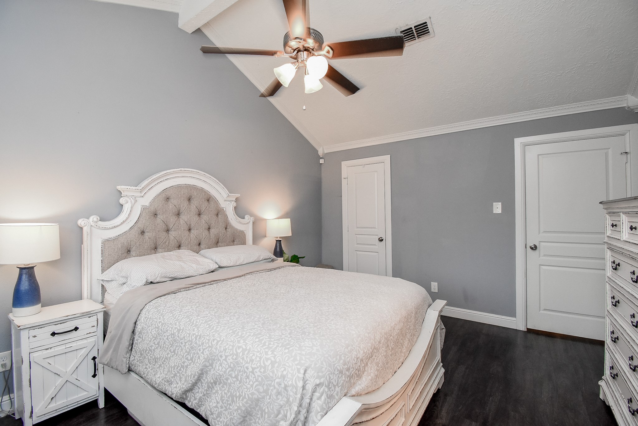 5911 Butterfly Circle Pasadena, TX 77505 - Photo 24 of 45 a bedroom with a bed and a chandelier
