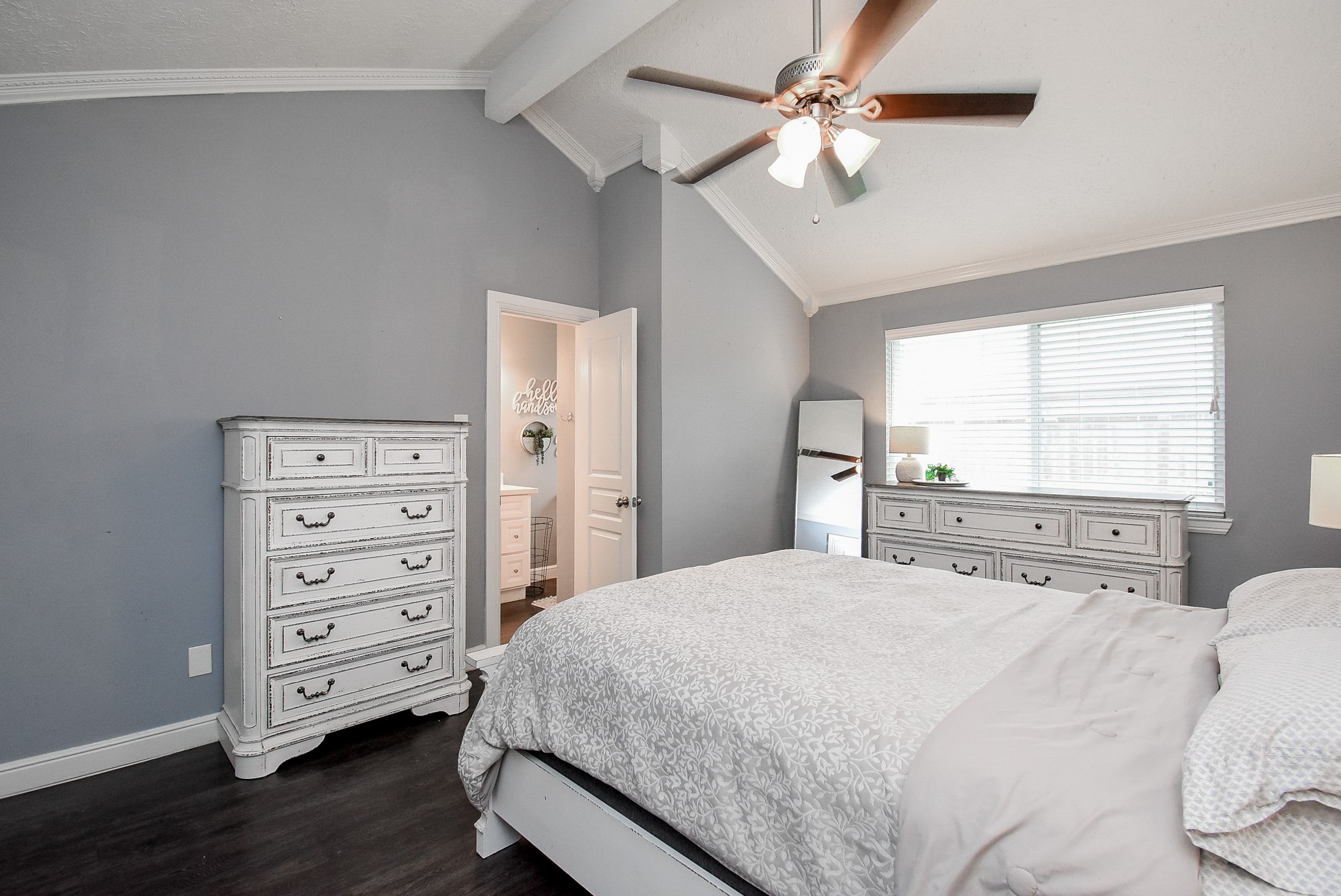 5911 Butterfly Circle Pasadena, TX 77505 - Photo 25 of 45 a bedroom with a bed a chandelier and a dresser