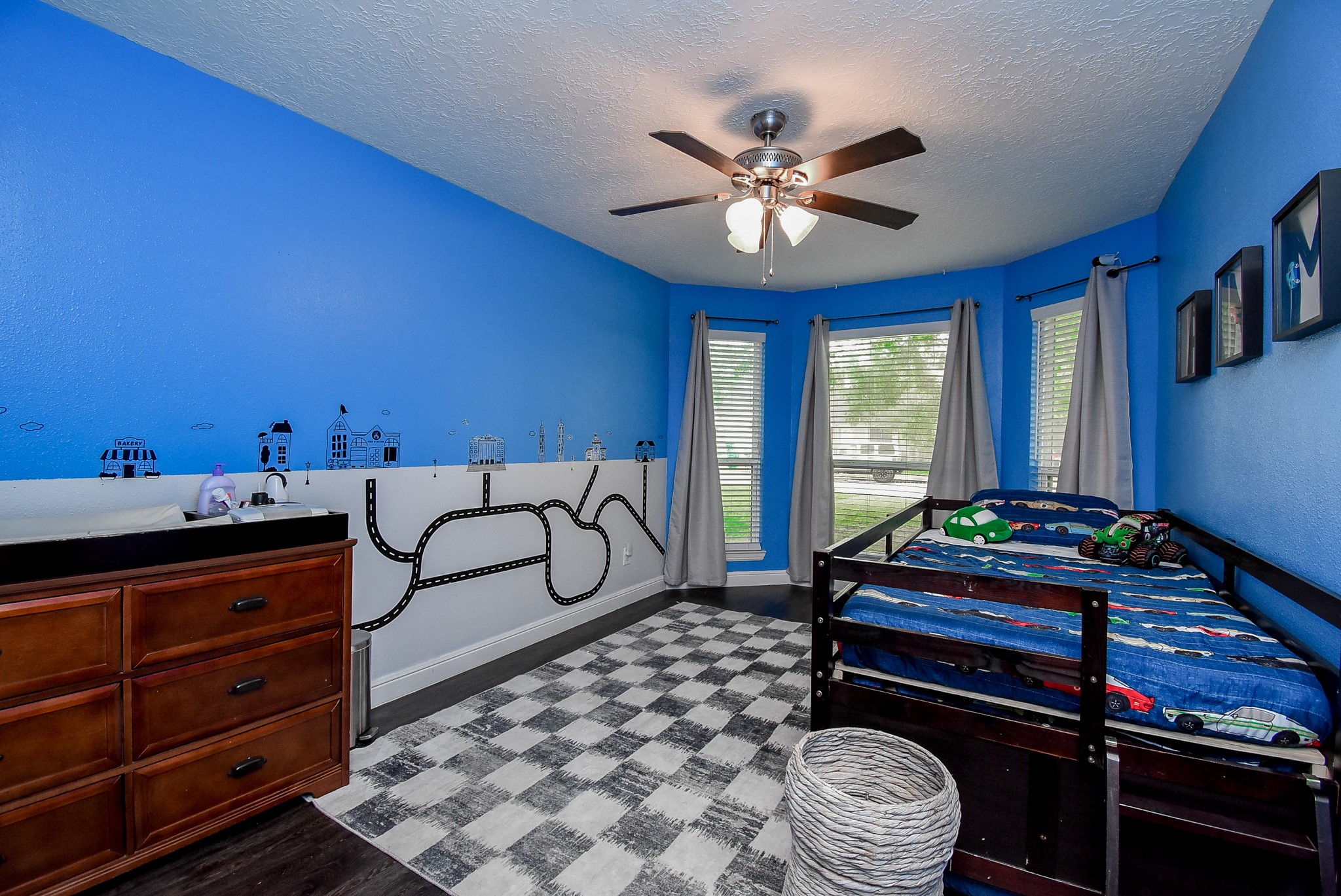 5911 Butterfly Circle Pasadena, TX 77505 - Photo 32 of 45 a bedroom with a bed and a chandelier