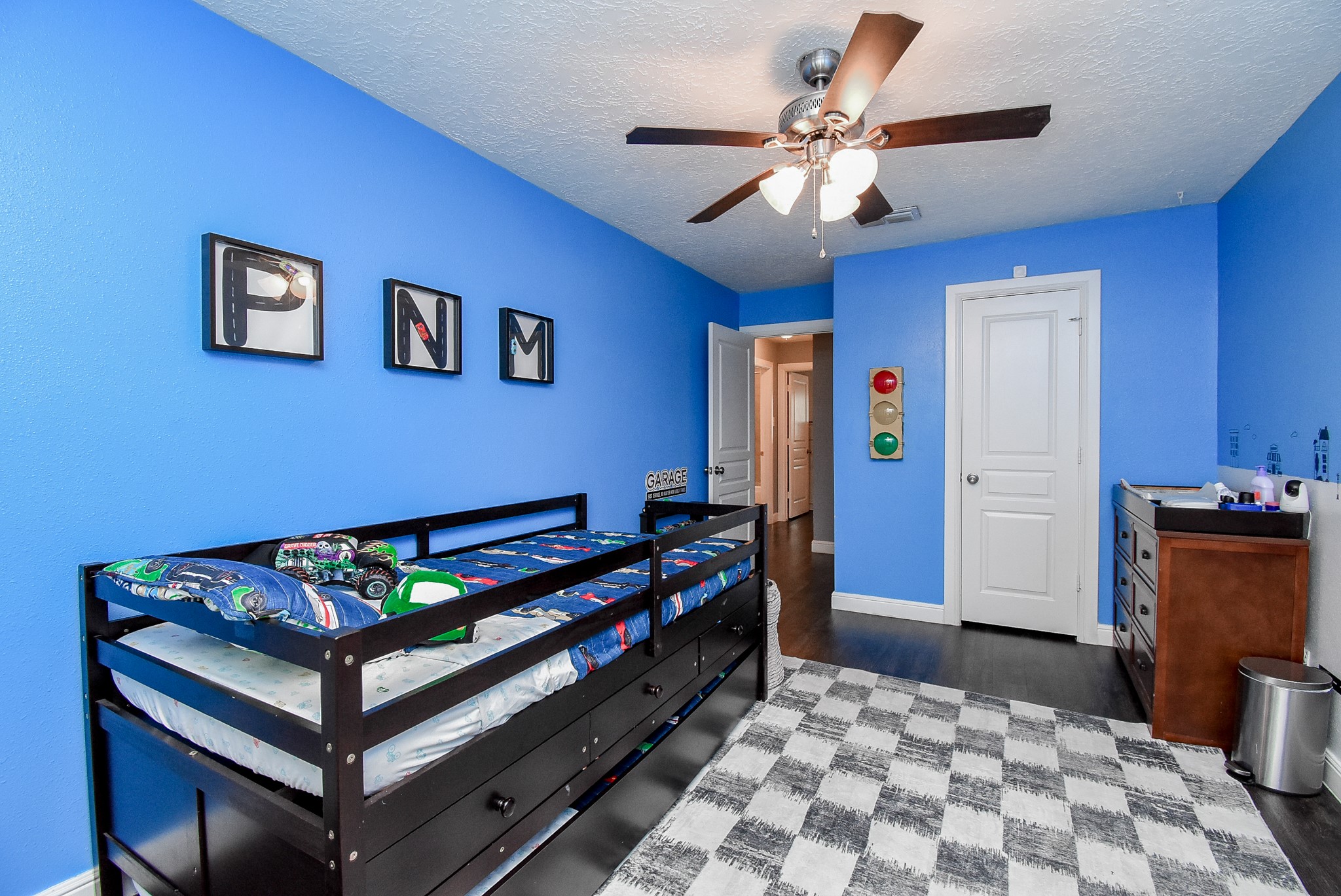 5911 Butterfly Circle Pasadena, TX 77505 - Photo 33 of 45 a bedroom with a bed and a chandelier