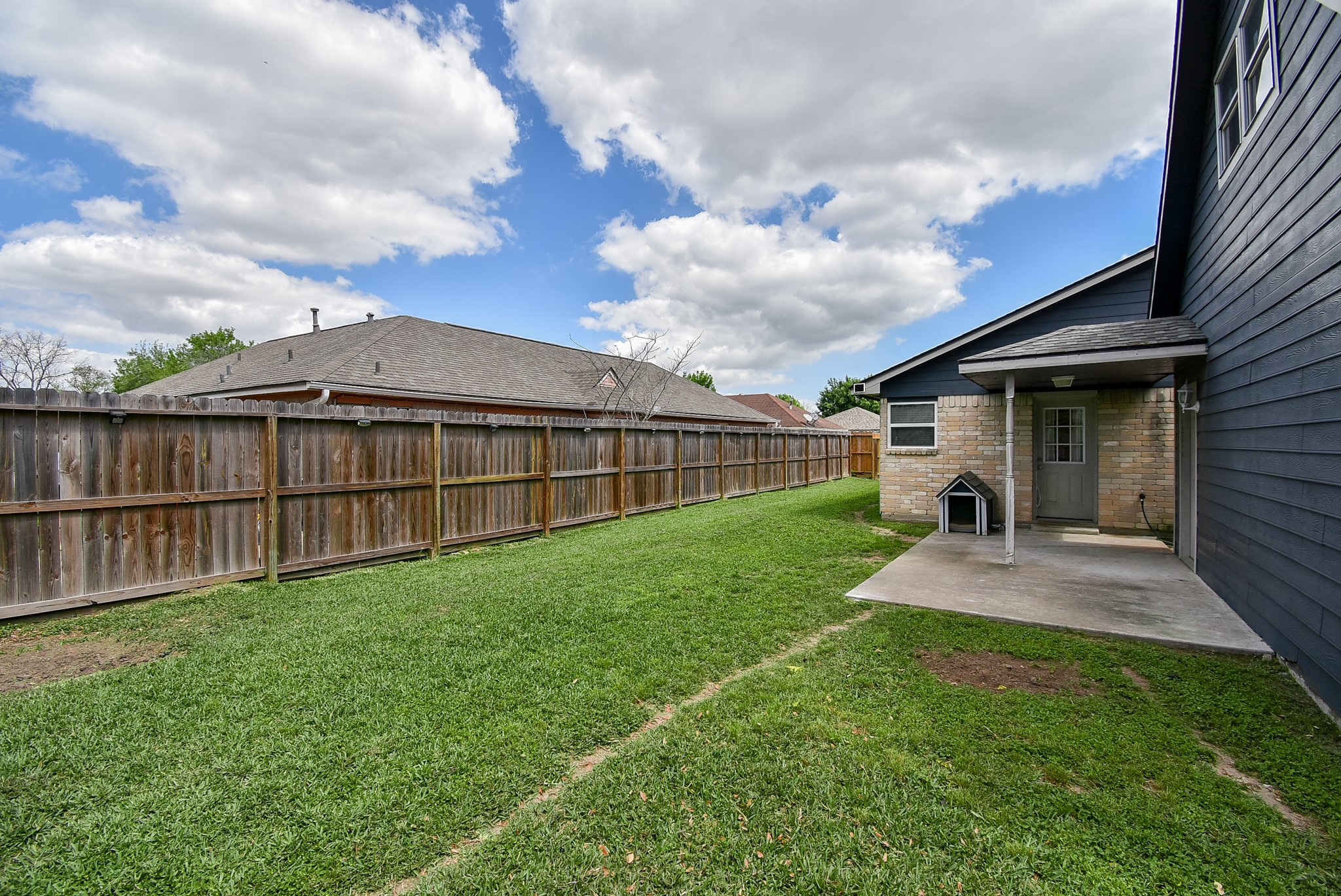 5911 Butterfly Circle Pasadena, TX 77505 - Photo 39 of 45 a view of a house with a big yard and wooden fence