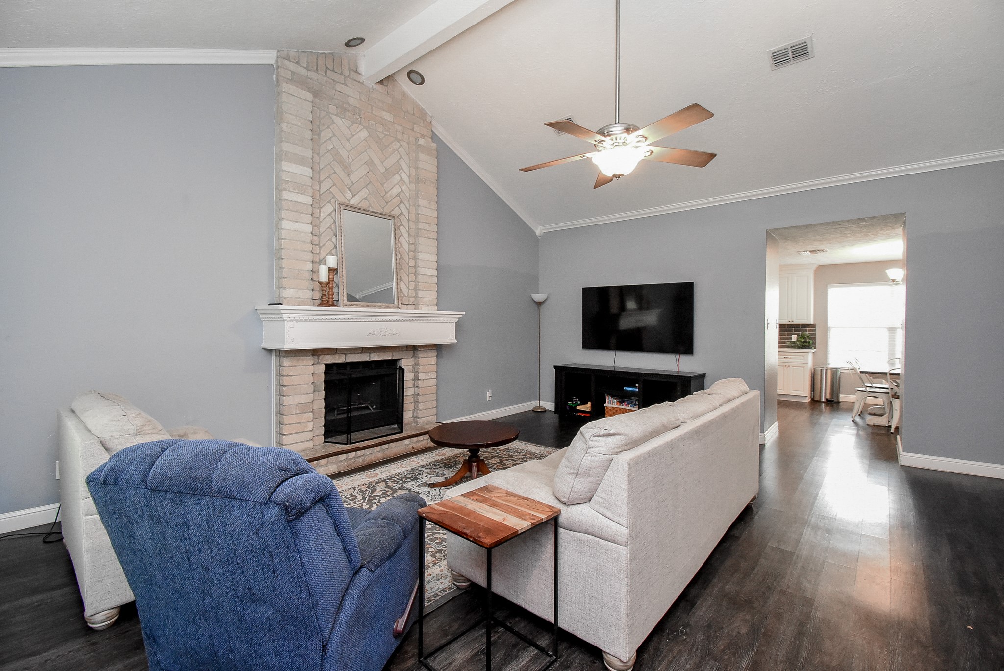 5911 Butterfly Circle Pasadena, TX 77505 - Photo 9 of 45 a living room with furniture a flat screen tv and a fireplace
