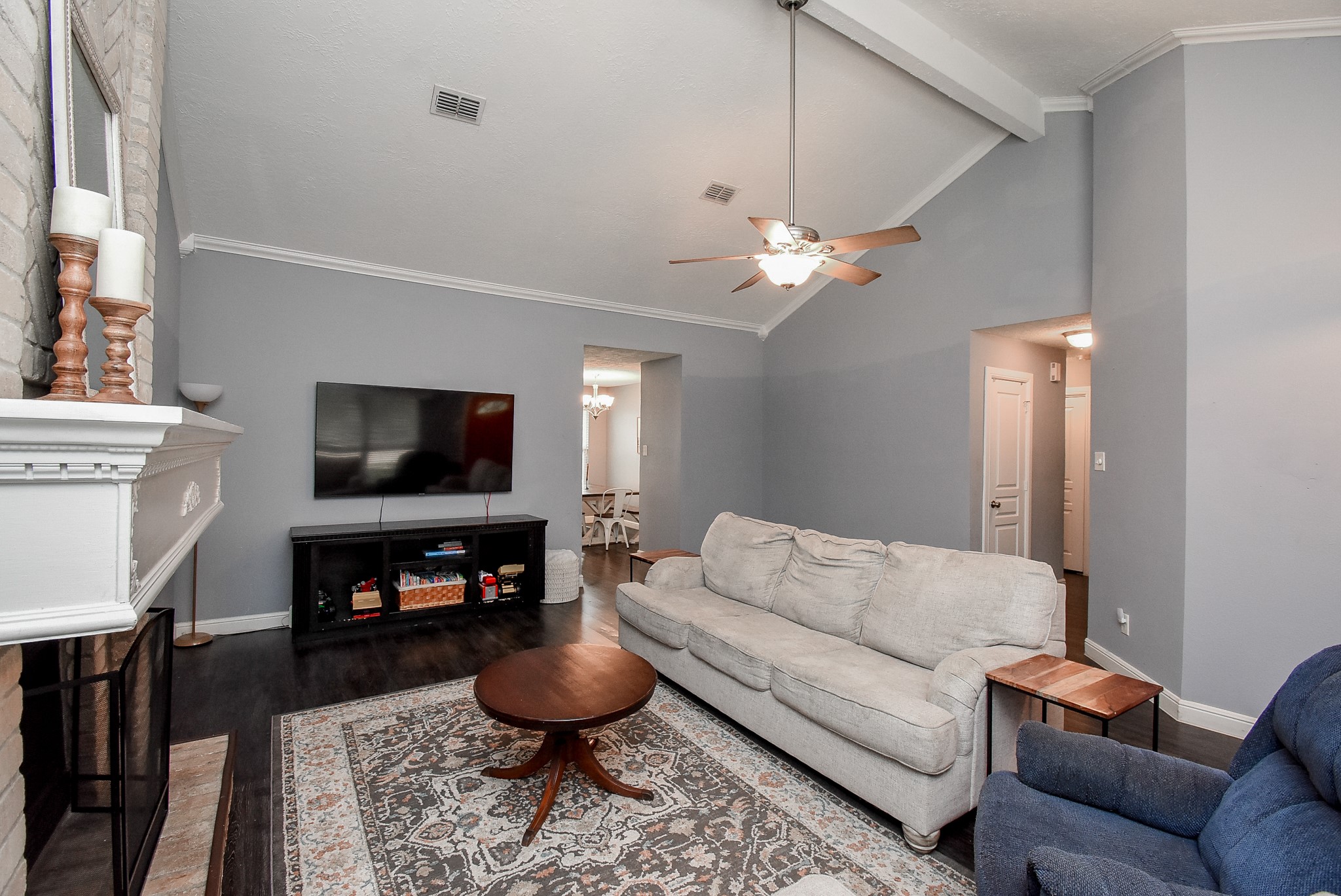 5911 Butterfly Circle Pasadena, TX 77505 - Photo 10 of 45 a living room with furniture a flat screen tv and a fireplace