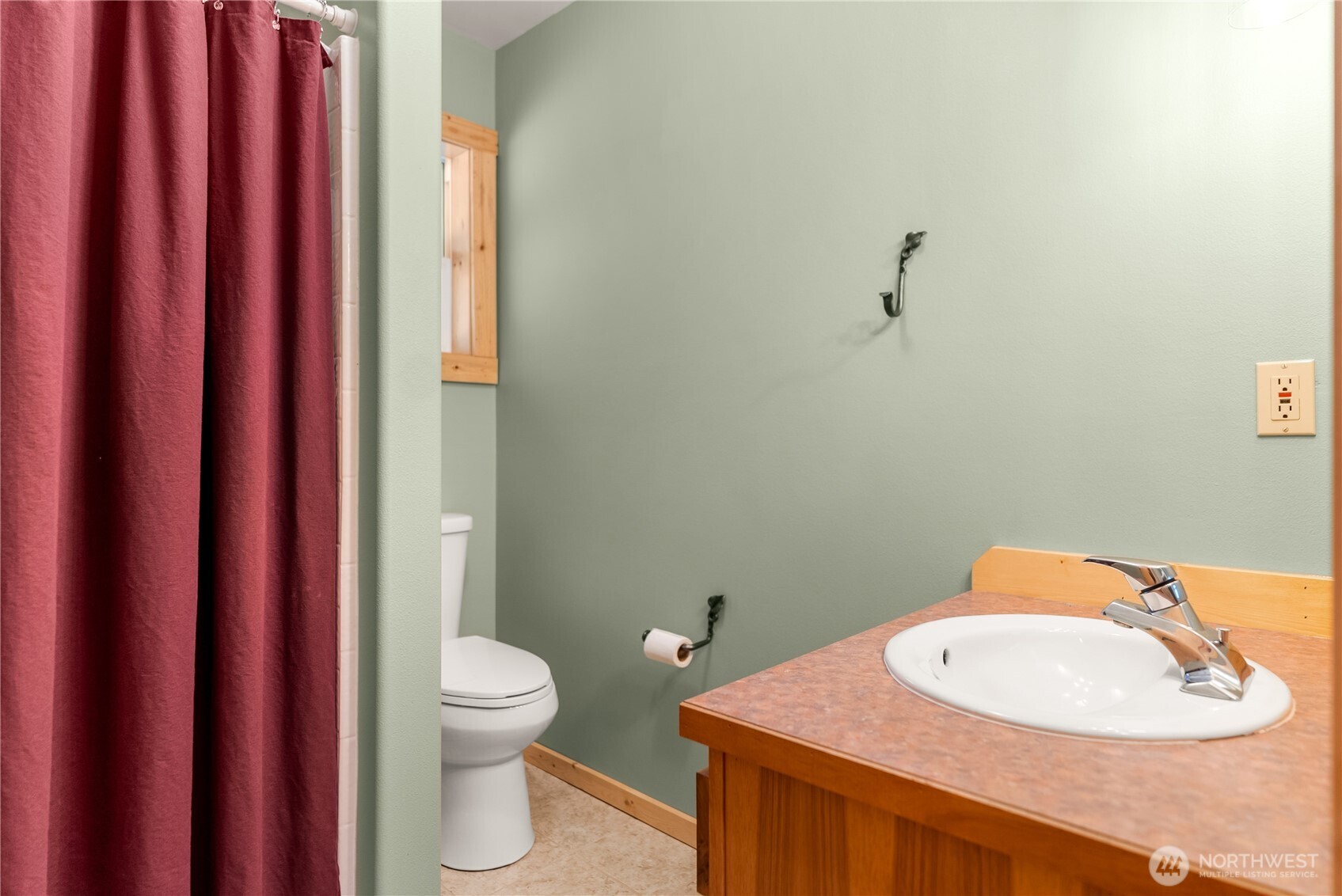 651 Lost River Road Mazama, WA 98833 - Photo 20 of 38 a bathroom with a toilet a sink and mirror
