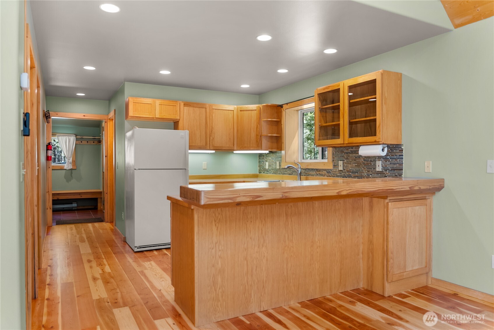 651 Lost River Road Mazama, WA 98833 - Photo 26 of 38 a kitchen with stainless steel appliances granite countertop a refrigerator and a sink