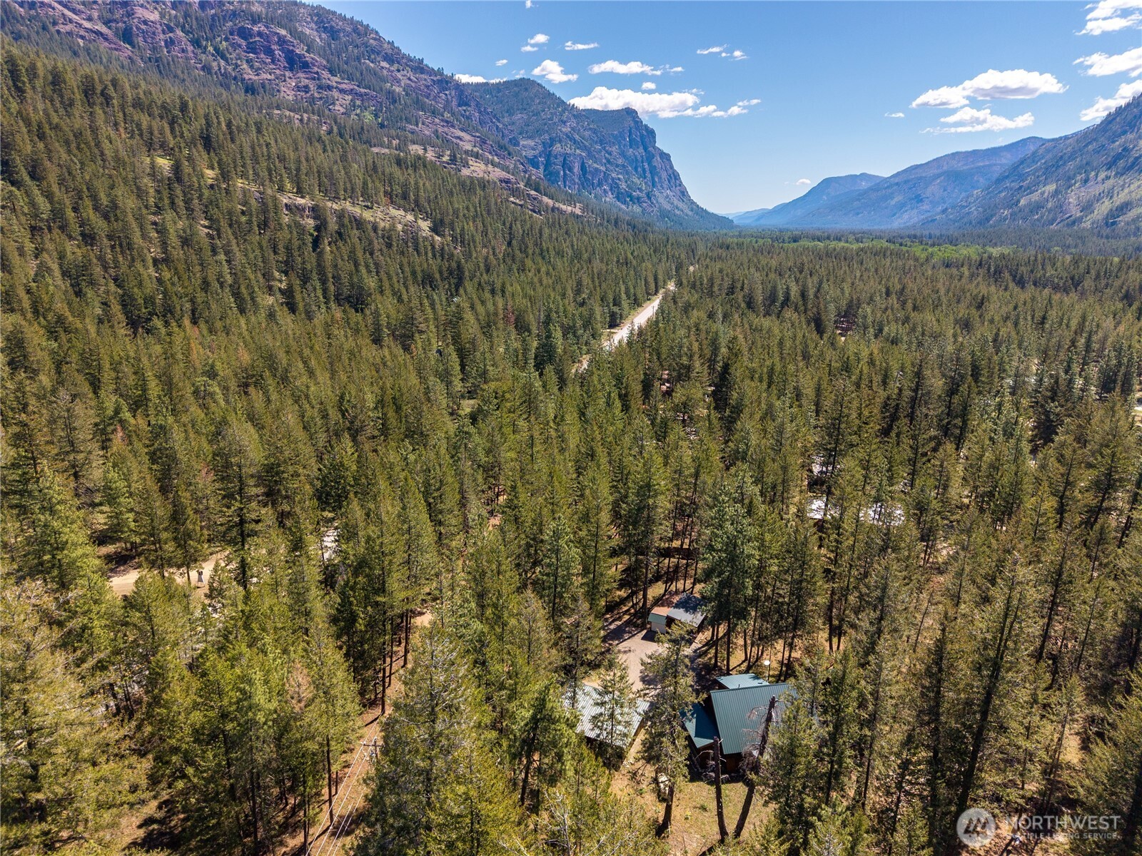 651 Lost River Road Mazama, WA 98833 - Photo 32 of 38 a view of a city with lush green forest